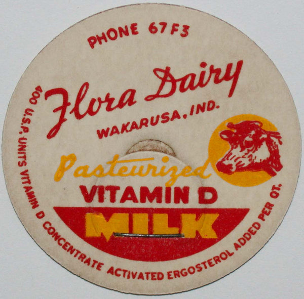 Vintage milk bottle cap FLORA DAIRY Phone 67F3 cow pictured Wakarusa Indiana