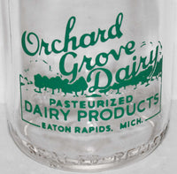 Vintage milk bottle ORCHARD GROVE DAIRY pyro half pint Eaton Rapids Michigan
