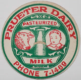 Vintage milk bottle cap PRUETER DAIRY cow and boy Phone 7-1469 Saginaw Michigan