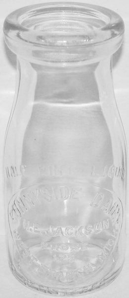 Vintage milk bottle SUNNYSIDE DAIRY embossed half pint Jackson West Branch Michigan