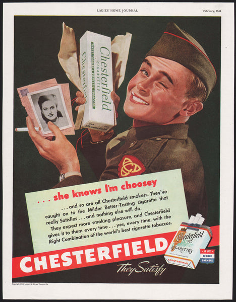 Vintage magazine ad CHESTERFIELD cigarettes from 1944 soldier holding carton