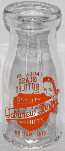 Vintage milk bottle FAIRVIEW DAIRY man pictured Antigo Wisconsin pyro half pint