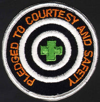 Vintage uniform patch PLEDGED TO COURTESY with green cross unused new old stock